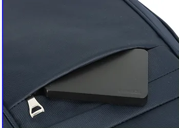 Top zip pocket of a school backpack