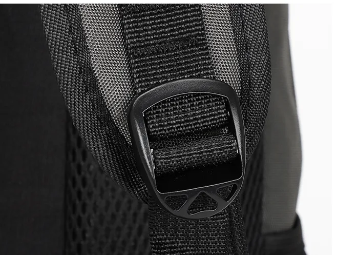 Close-up of a shoulder strap adjuster on a backpack strap