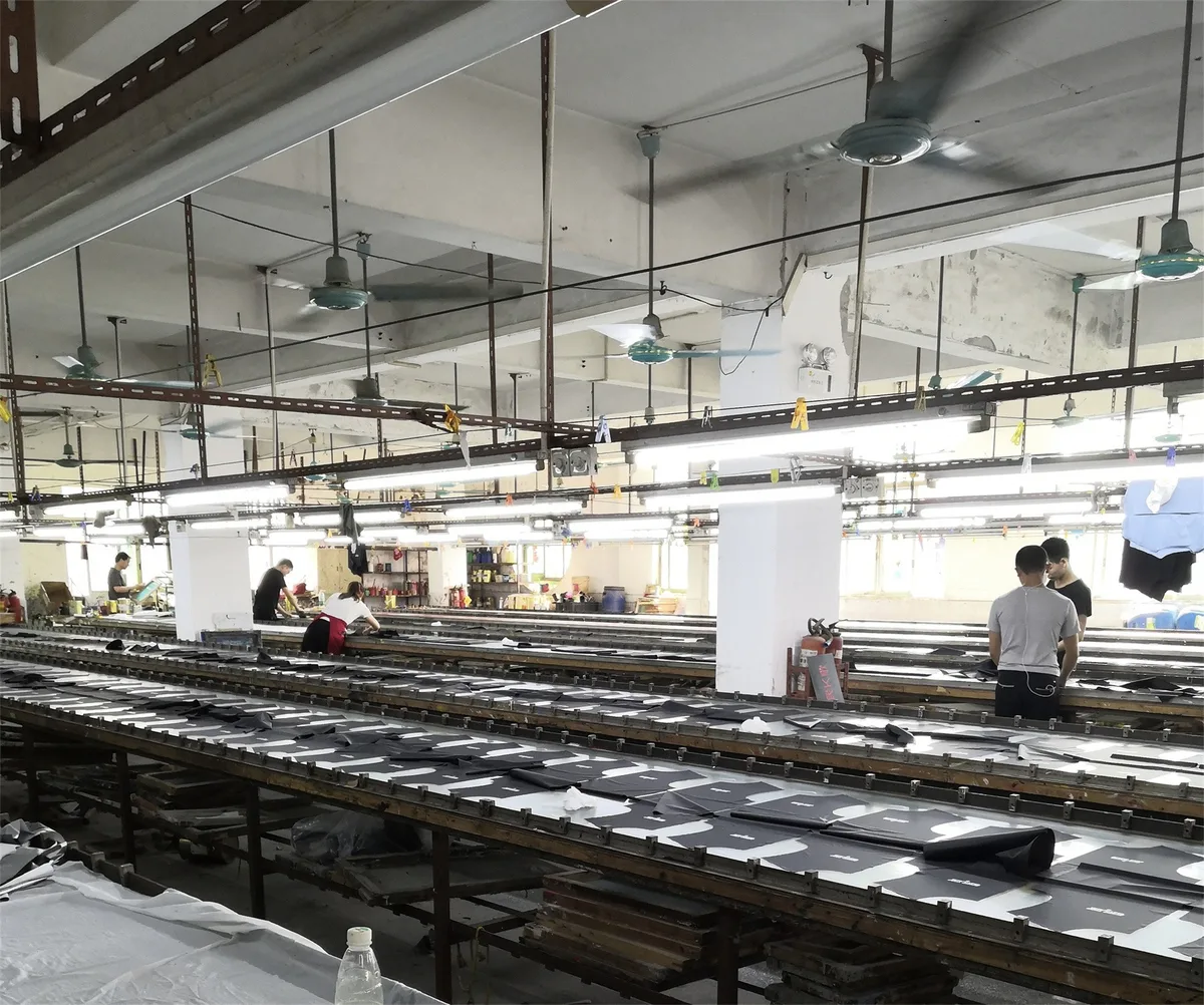 Wide view of the cutting floor with multiple cutting tables in use